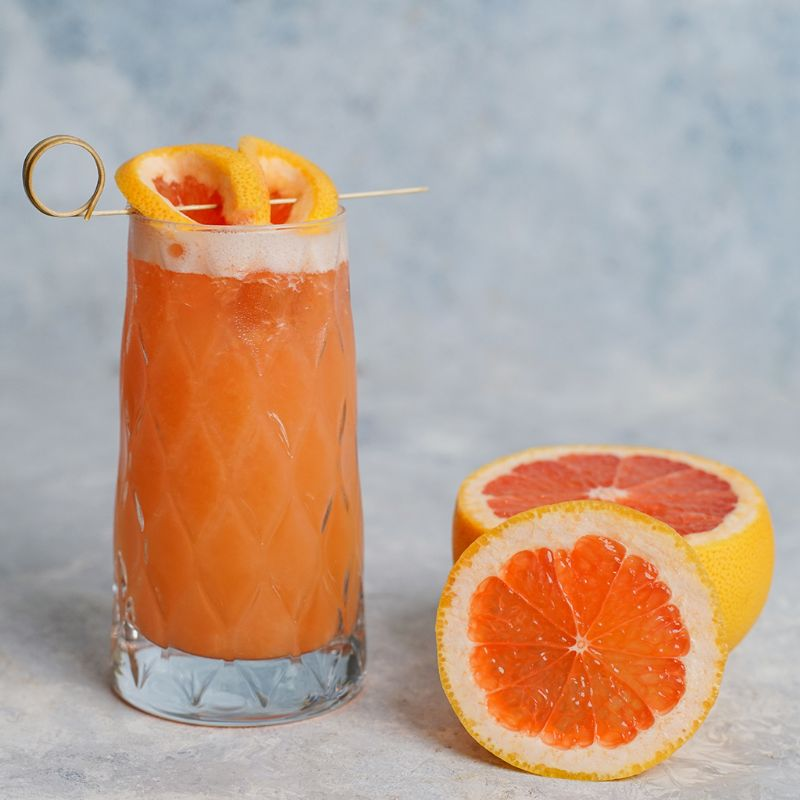 Freshly squeezed grapefruit juice on the table