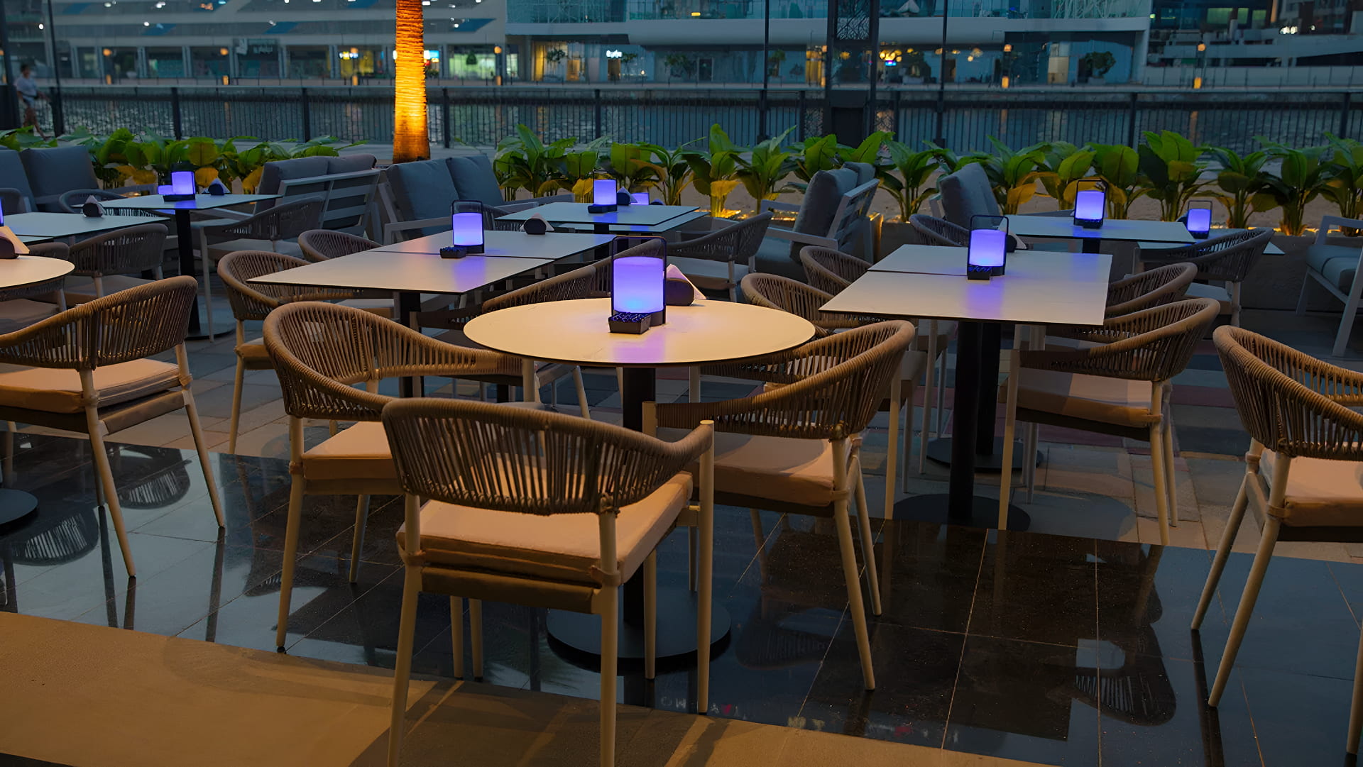 outdoor dining area of Babati shisha lounge with modern tables and chairs