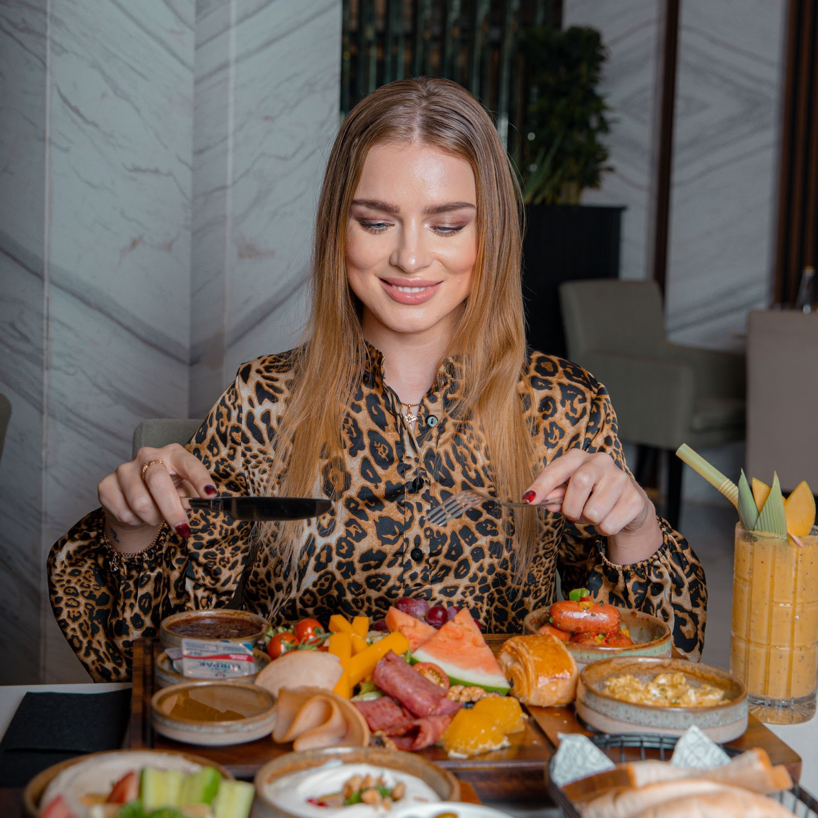 A woman enjoying a vibrant Lebanese breakfast in Business Bay
