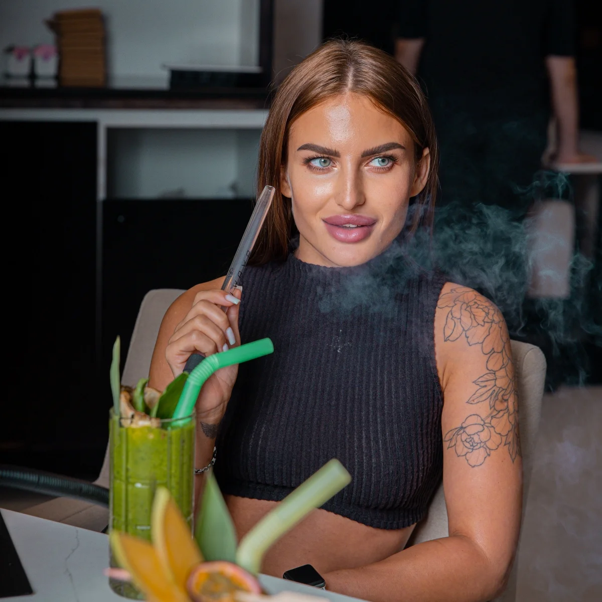 Lady enjoying Shisha and beverage